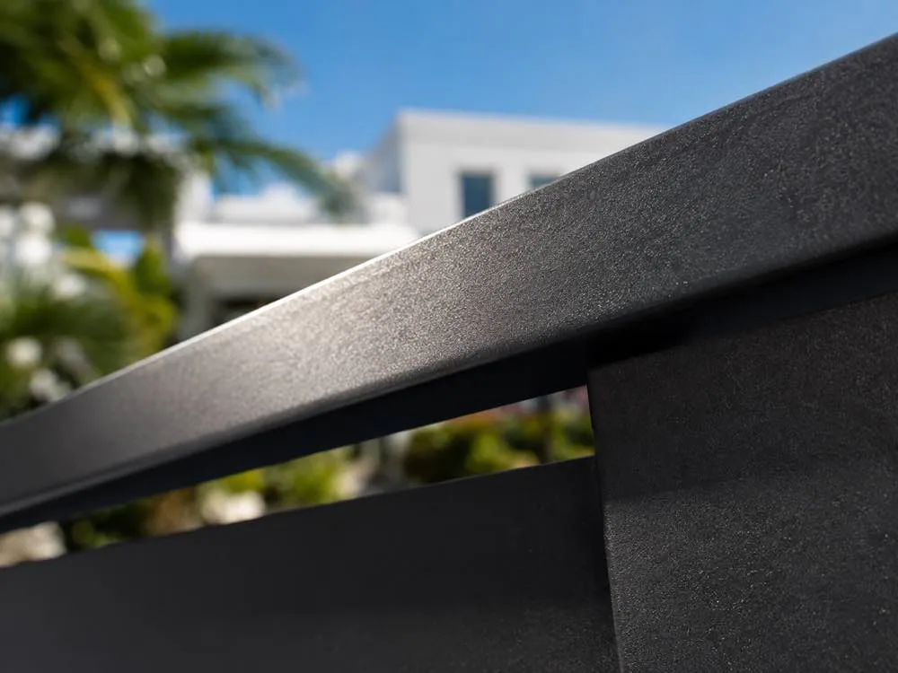 Close-up of an aluminum gate top rail