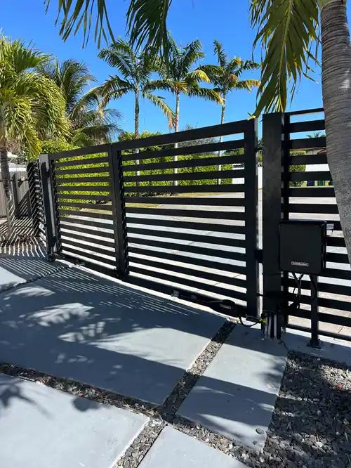 Horizontal-slat aluminum driveway gate with an automatic opener